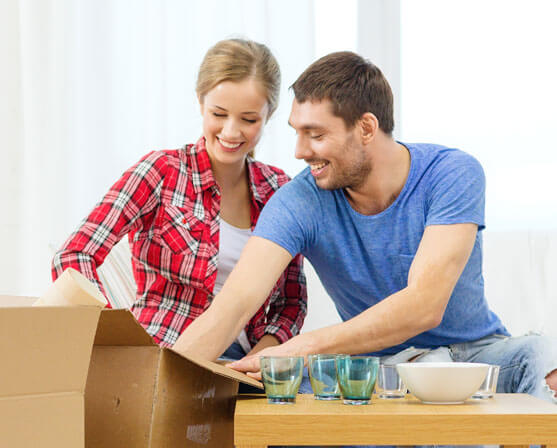 photo of a couple unboxing after a move