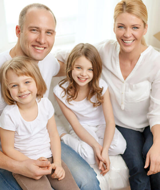 photo of a happy family of four after a successful move